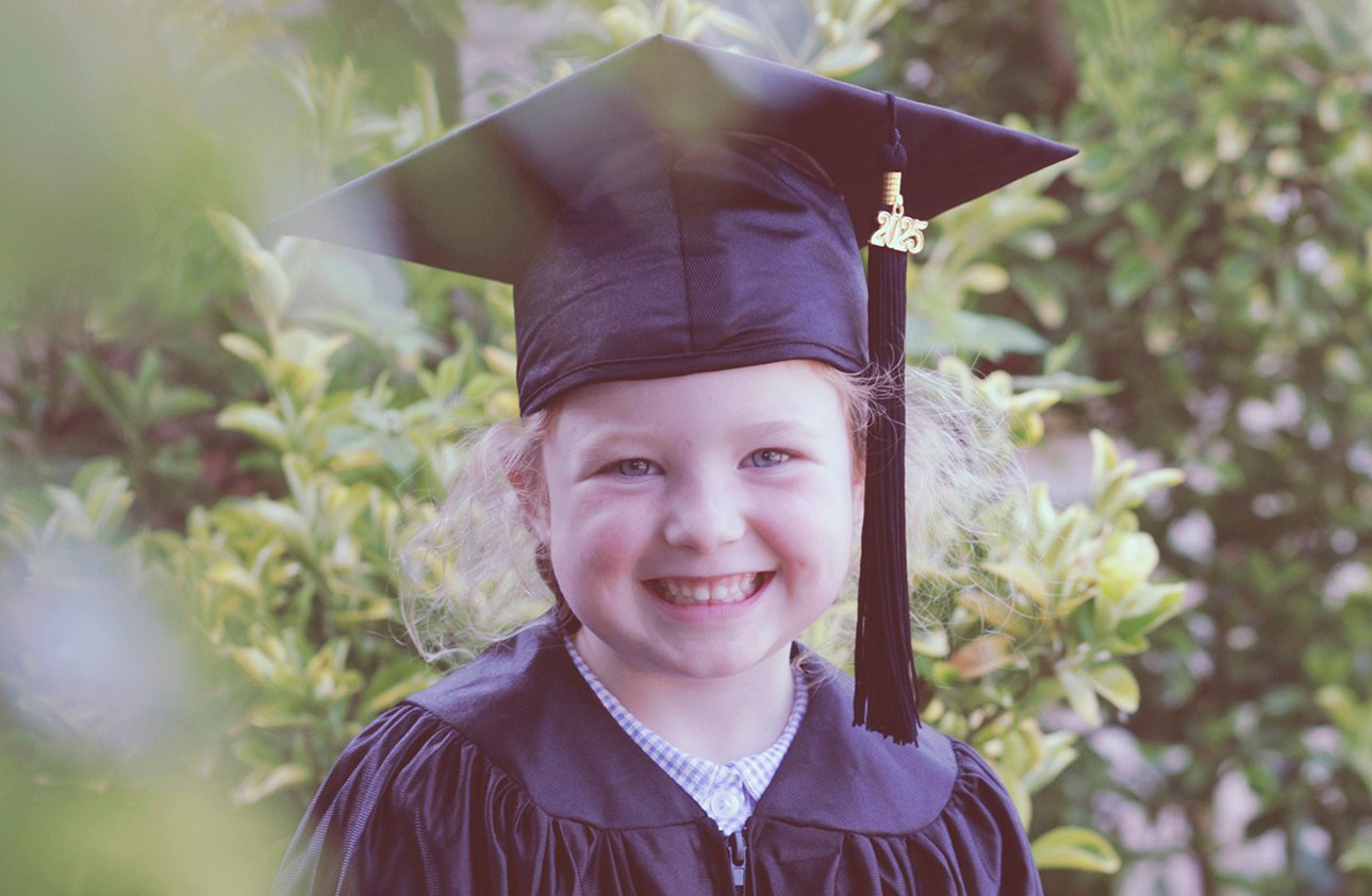 Child in Graduation Outfit