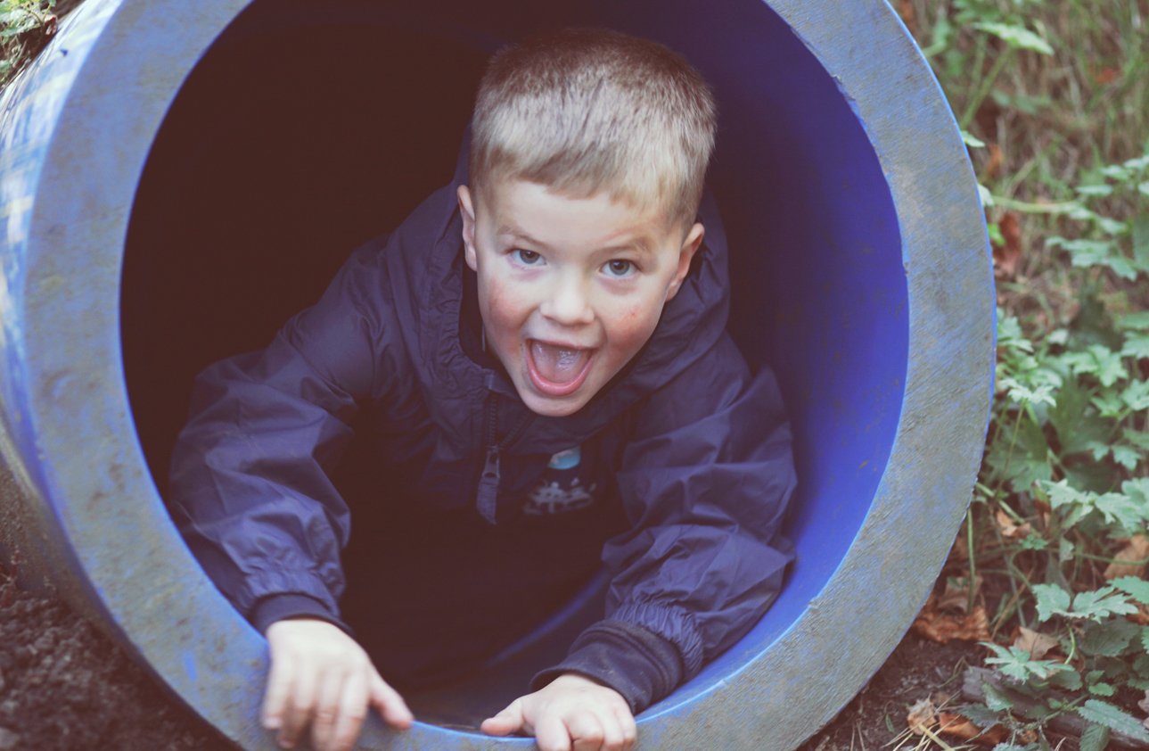 Young Child Playing in a Tunnel