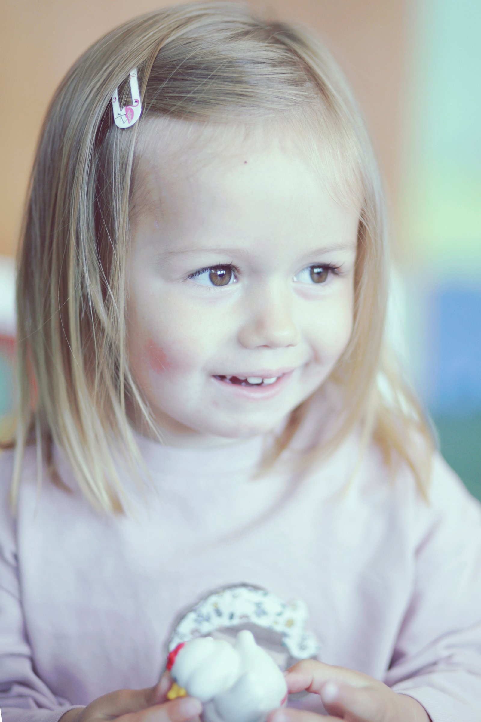 Young child in nursery smiling