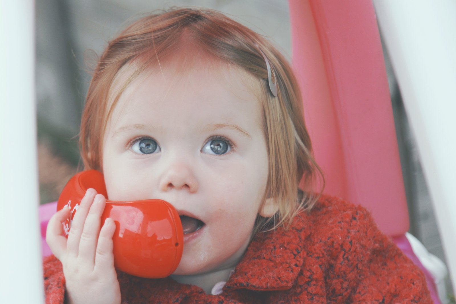 Nursery Child playing with toy phone